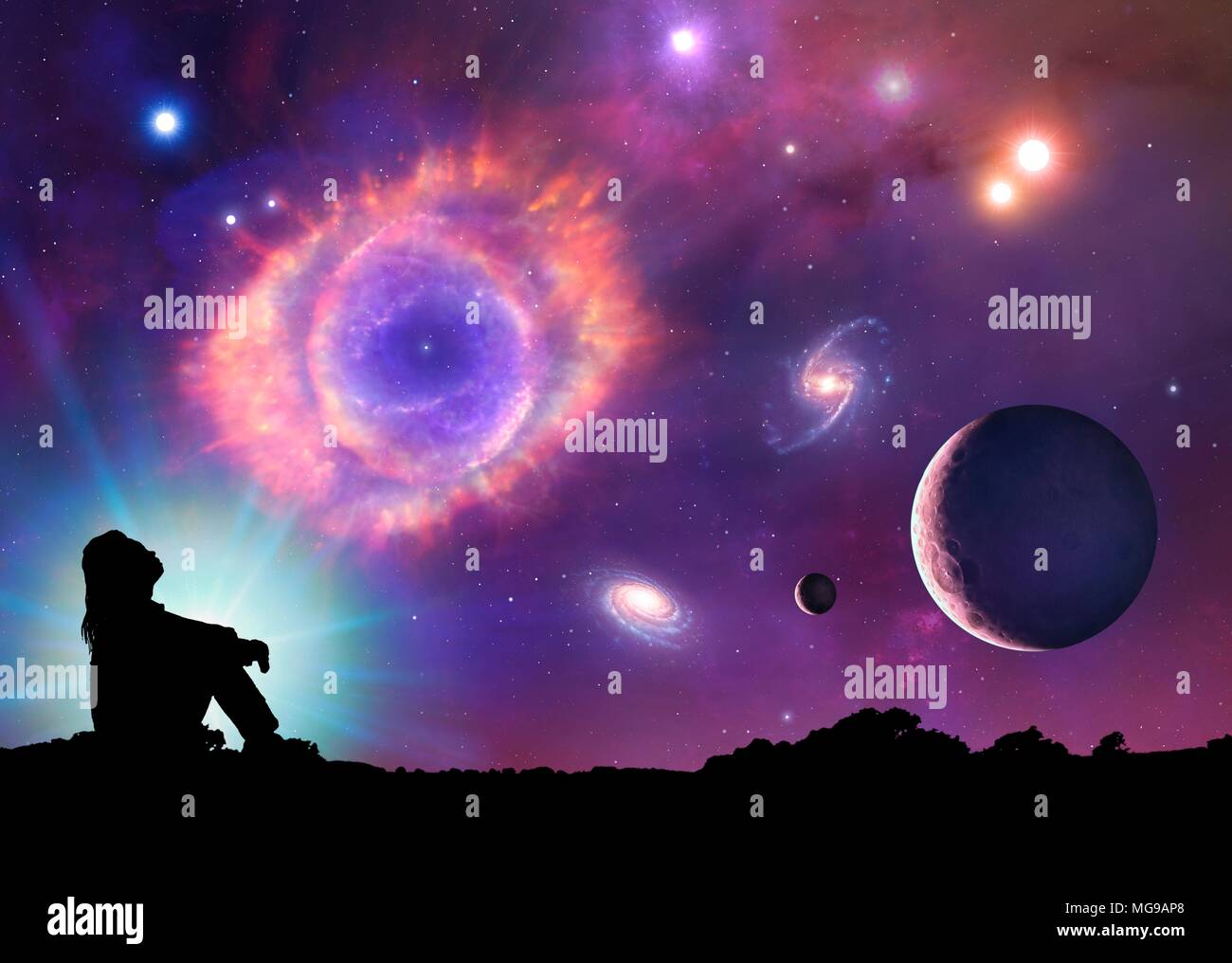 This is a conceptual illustration representing space and astronomy in general. It shows the various objects that can be found in the Universe: planets, moons, stars, nebulae and galaxies. The centrepiece is a planetary nebula, the cast-off remains of a dying star. A woman in silhouette is seen looking up into space. Stock Photo