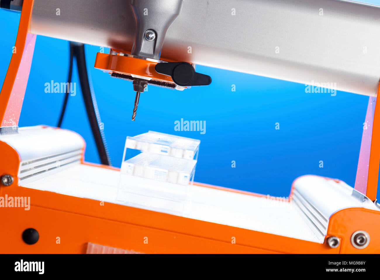 CNC milling machine drilling plastic block Stock Photo Alamy