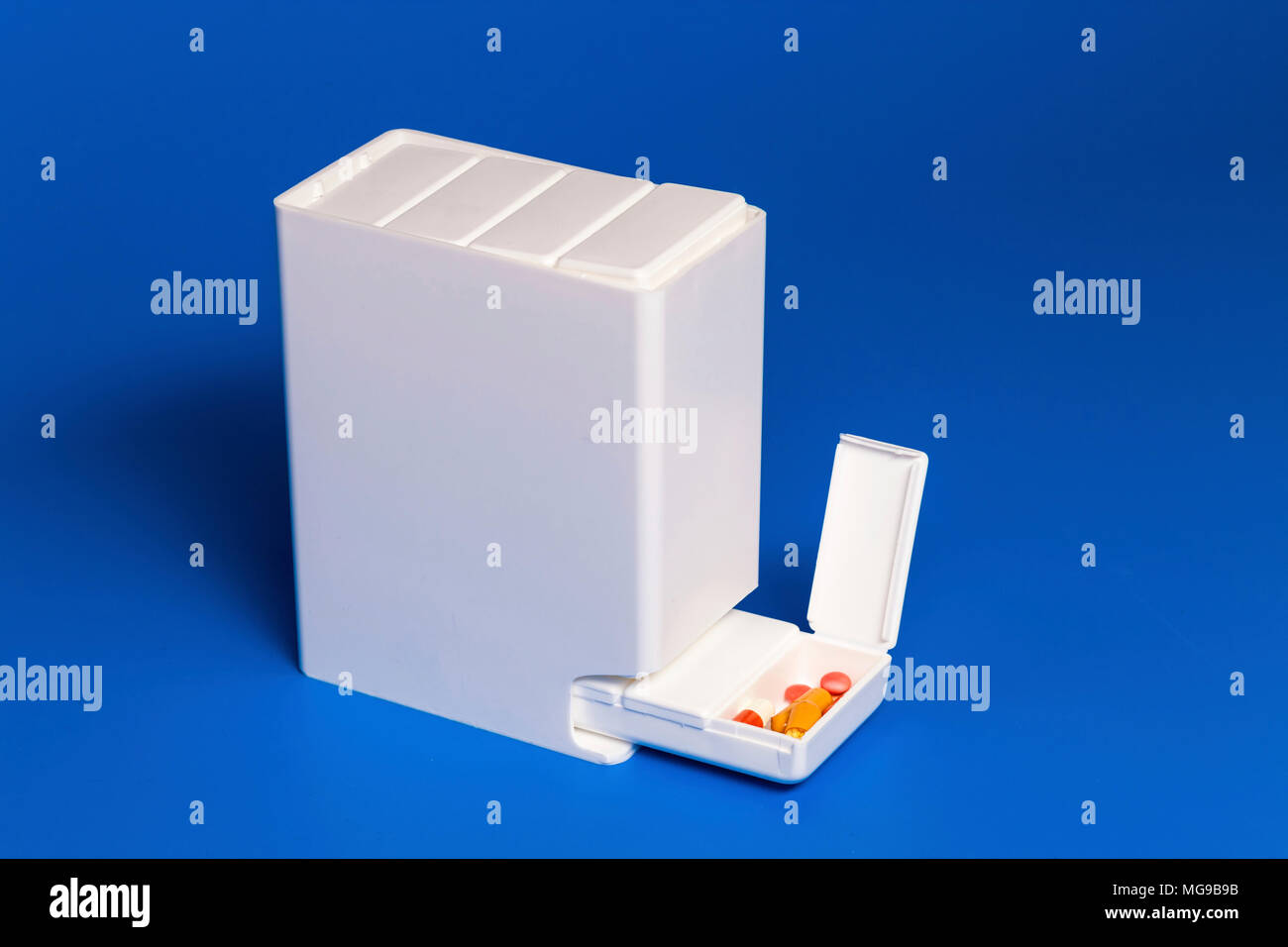 Dispenser with tablets. Stock Photo