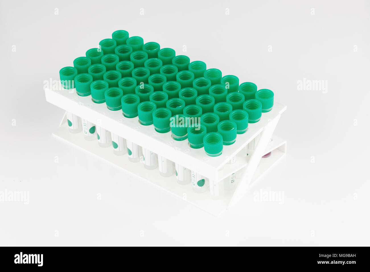 Plastic test tubes in rack Stock Photo Alamy