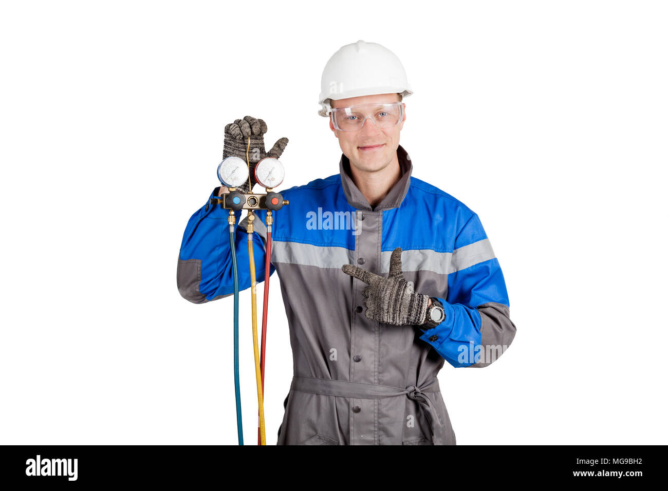 Builder, installer of ventilation with tools in hands Stock Photo