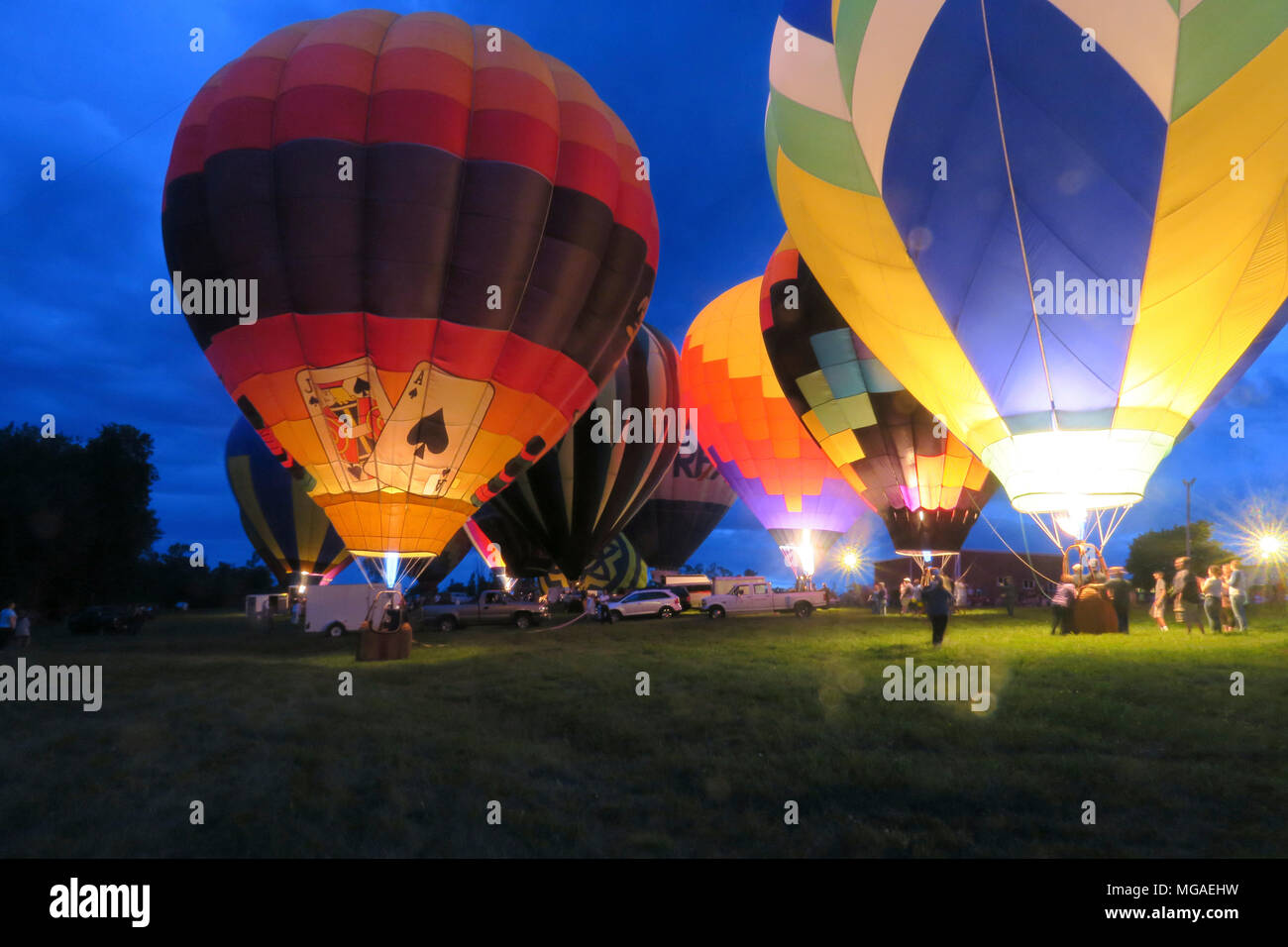 Hot air balloon glow with flames at a Connecticut balloon festival evening balloon glow Stock Photo