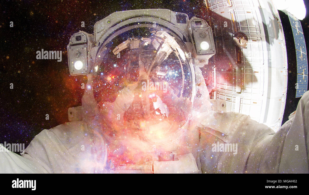 Astronaut in outer space. Science fiction art. Elements of this image ...