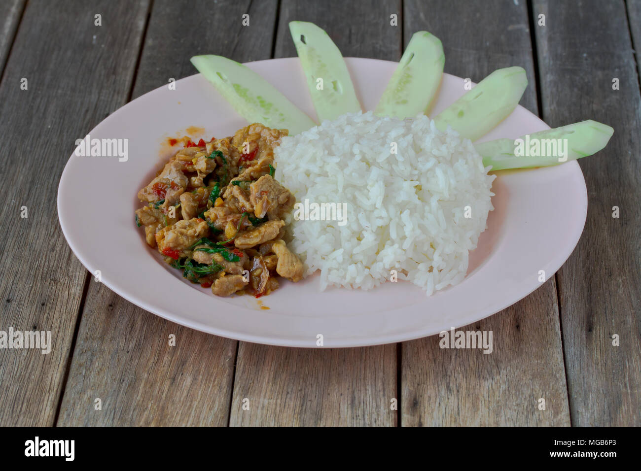 Thai spicy food basil chicken fried rice recipe on table Stock Photo