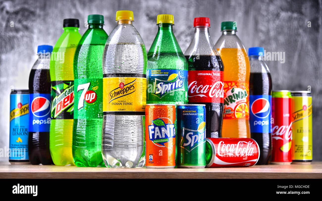 POZNAN, POLAND - APR 6, 2018: Bottles of global soft drink brands including products of Coca Cola Company and Pepsico Stock Photo