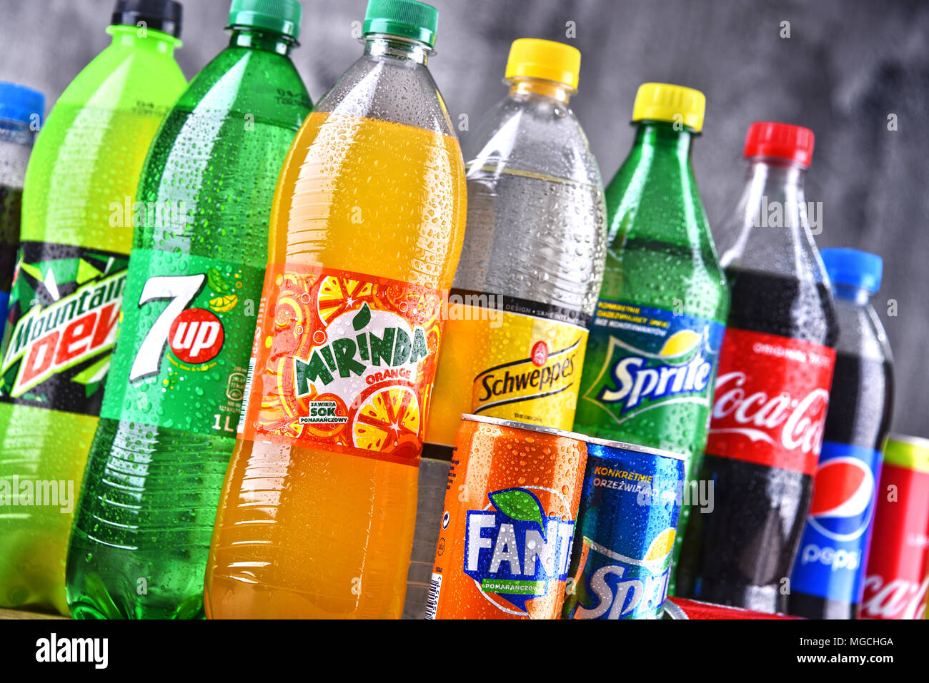 POZNAN, POLAND APR 6, 2018 Bottles of global soft drink brands including products of Coca