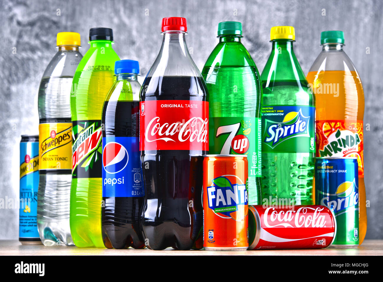 POZNAN, POLAND - APR 6, 2018: Bottles of global soft drink brands including products of Coca Cola Company and Pepsico Stock Photo