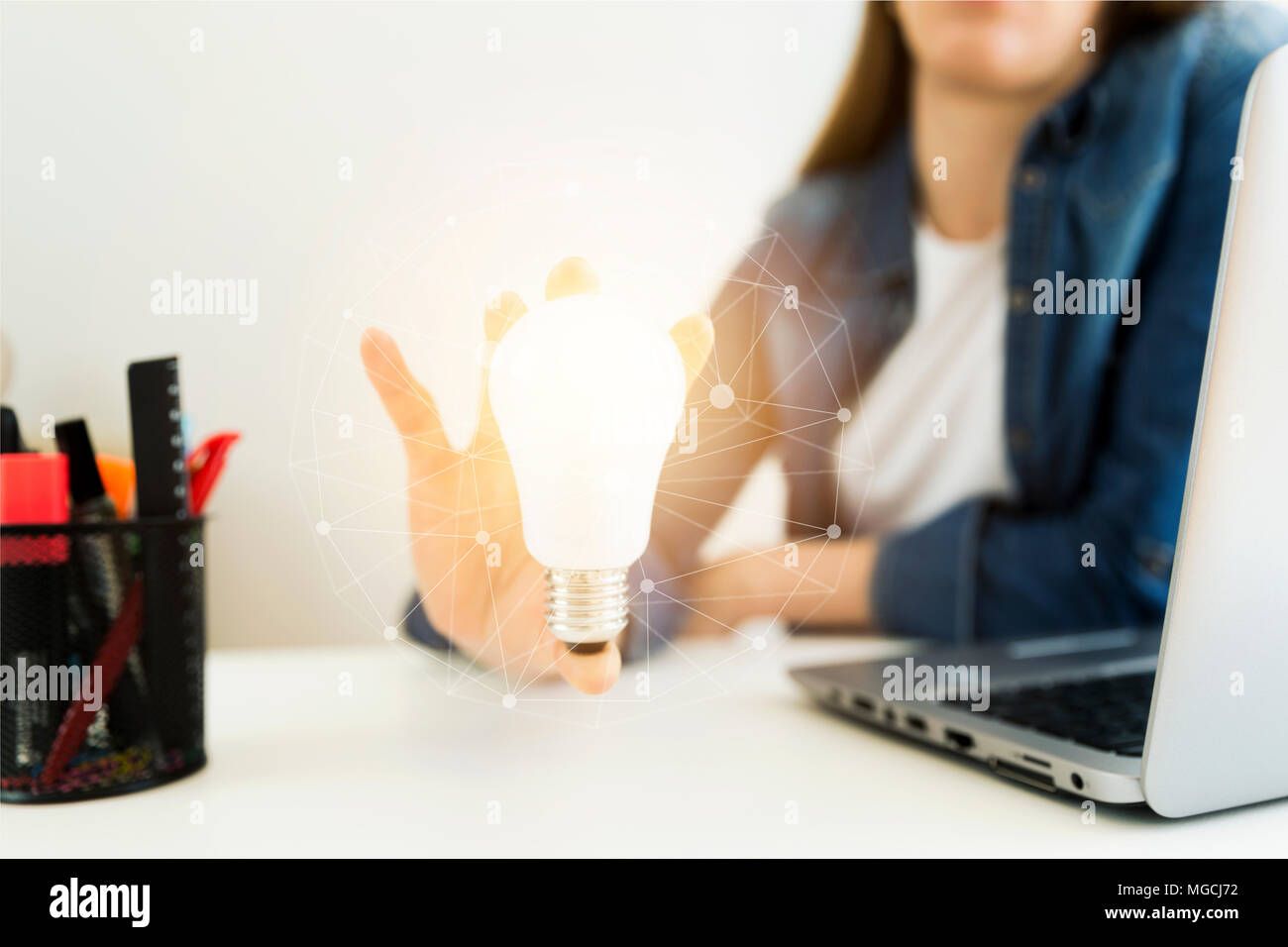 Business women's, designer's hand holding light bulb, concept of new ...