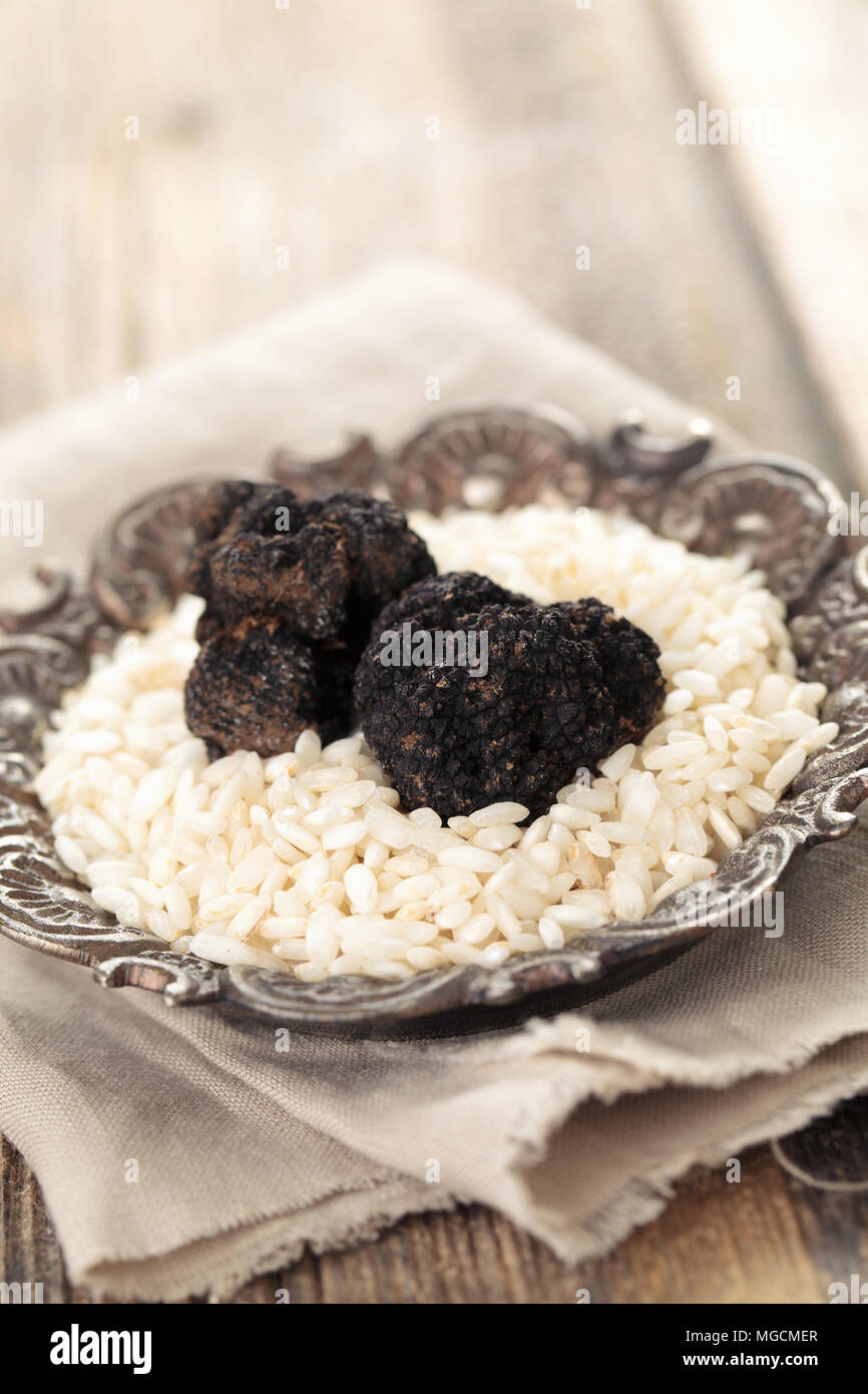 Black truffles and white rice.  Stock Photo