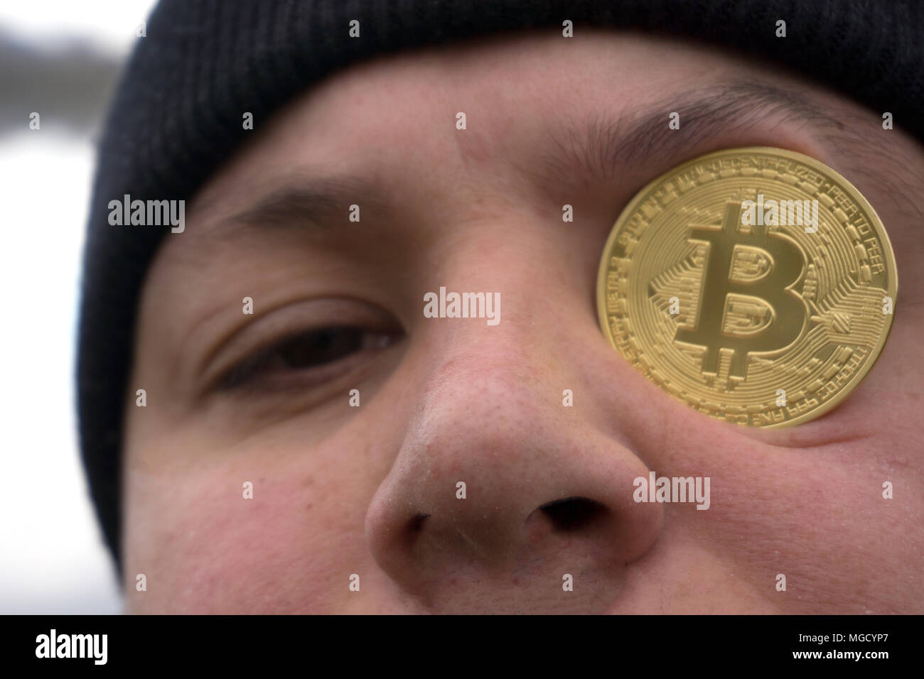 a serious man with bitcoin (new virtual money ) Stock Photo