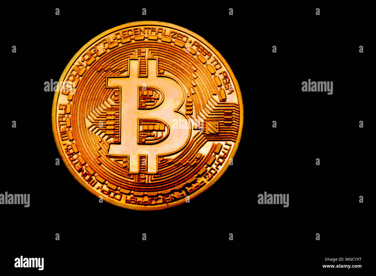 Bitcoin in the dark. Close up view on heap of golden bitcoins. Black background with copyspace Stock Photo