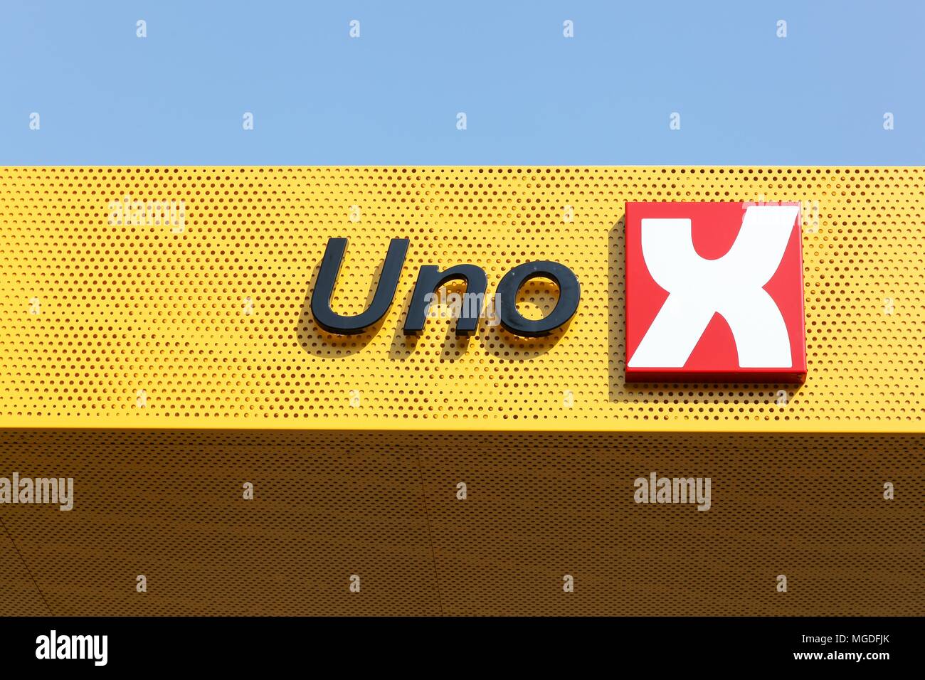Brabrand, Denmark - April 20, 2018: Uno-X logo on a fuel station. Uno-X is a chain of unmanned fuel stations throughout Norway and Denmark Stock Photo