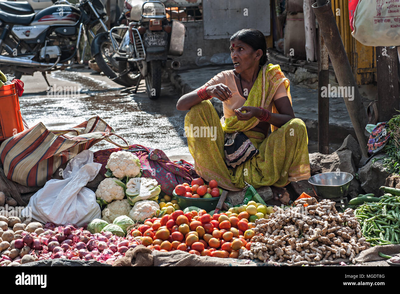 AURANGABAD, INDIA-Dec, 30 2016: The colorful of fresh open air Gulmandi local market. Woman selling vergetable on street side walk. This is one of the Stock Photo