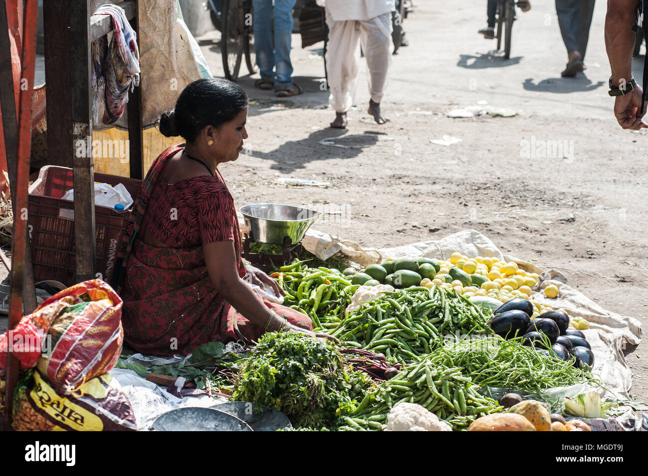 AURANGABAD, INDIA-Dec, 30 2016: The colorful of fresh open air Gulmandi local market. Woman selling vergetable on street side walk. This is one of the Stock Photo