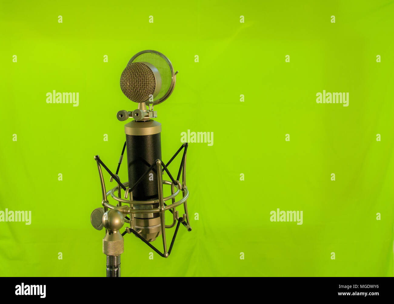 Vocal condenser microphone with wind screen isolated on green background Stock Photo Alamy