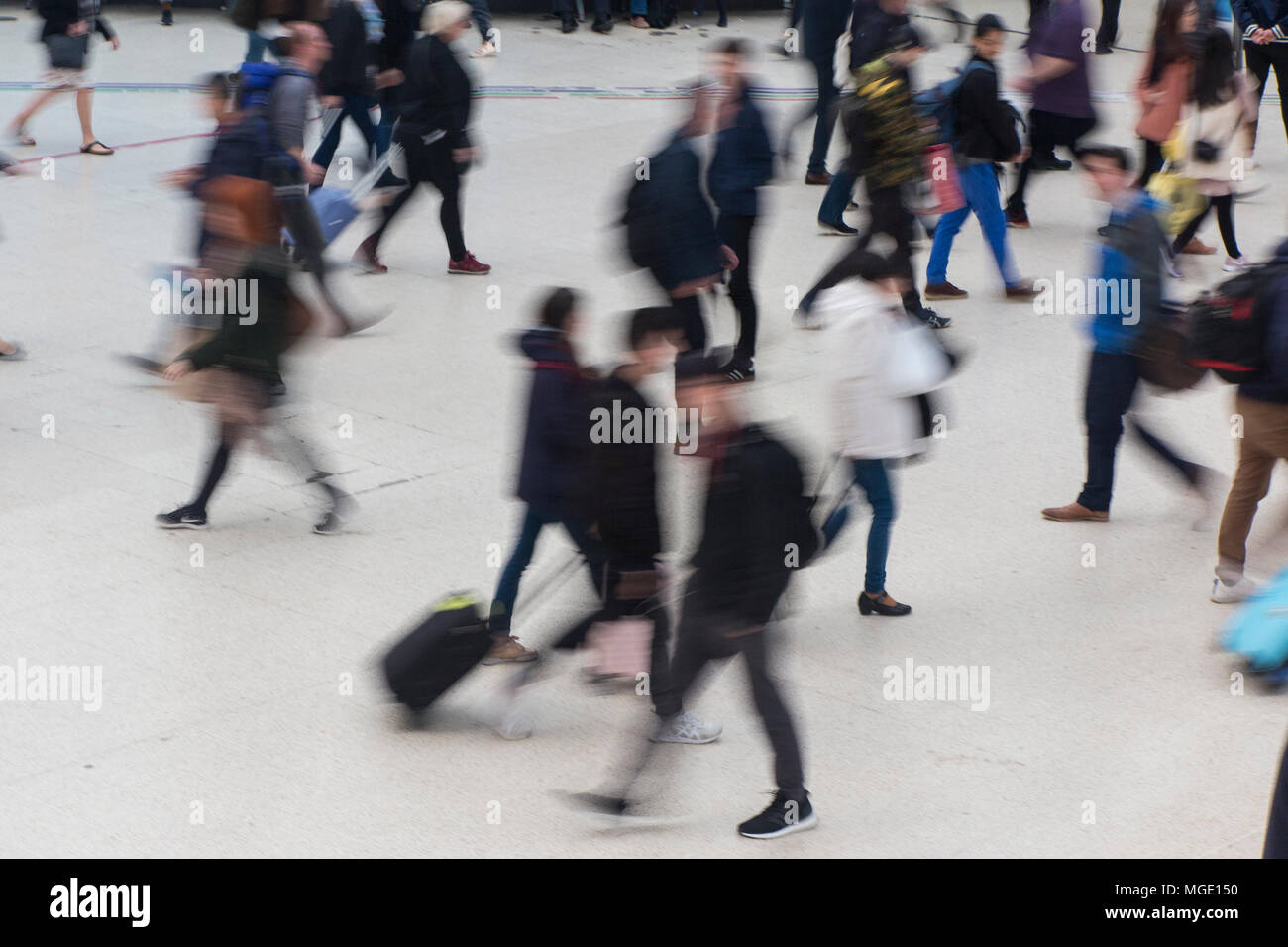 Blurred figures rushing to catch a train Stock Photo