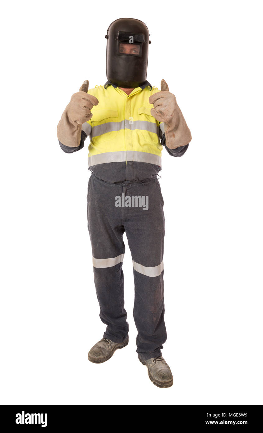 A welder wearing his PPE gives a positive hand signal, full length on white. Stock Photo