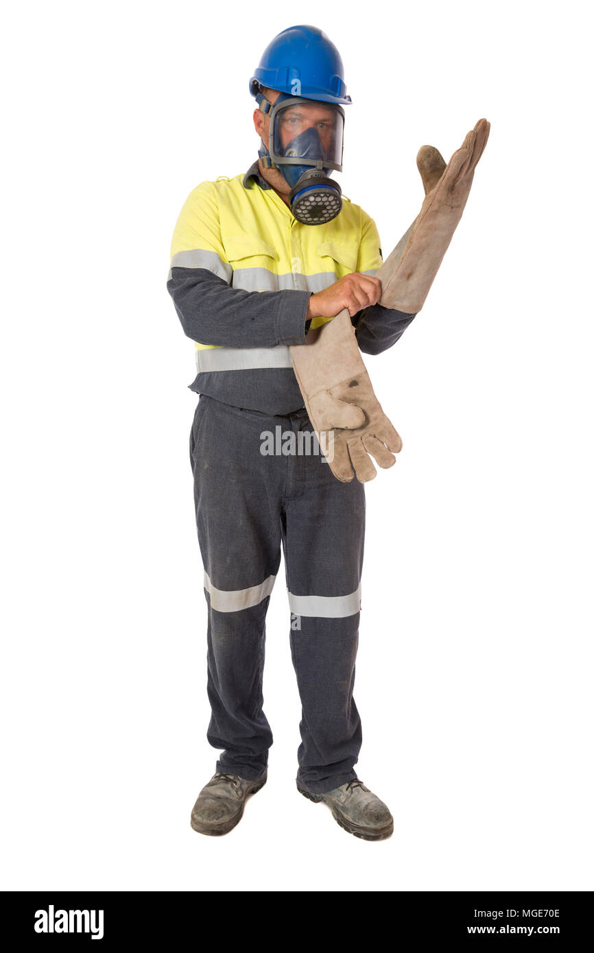 A worker putting on personal protective equipment for working in an hazardous environment. Stock Photo