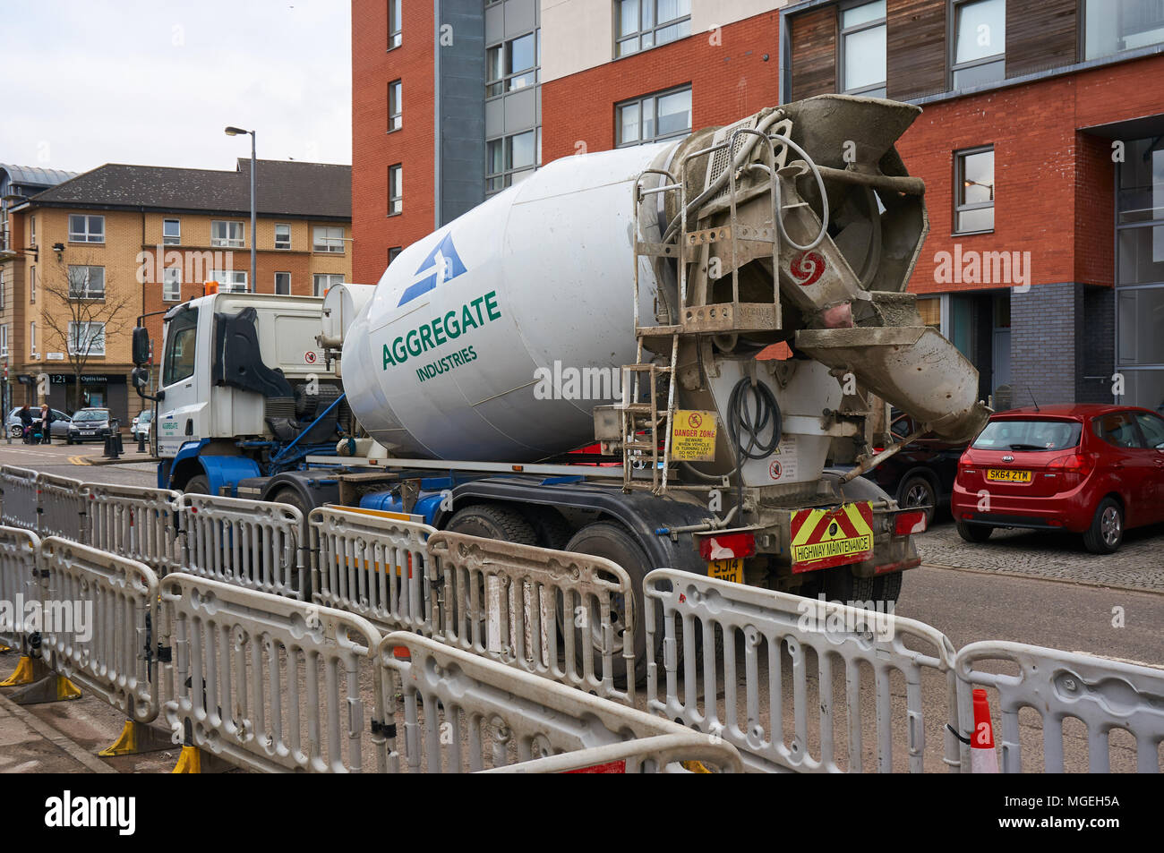 Cement mixer branded Aggregate Industries parked within the residential area of Glasgow. Stock Photo