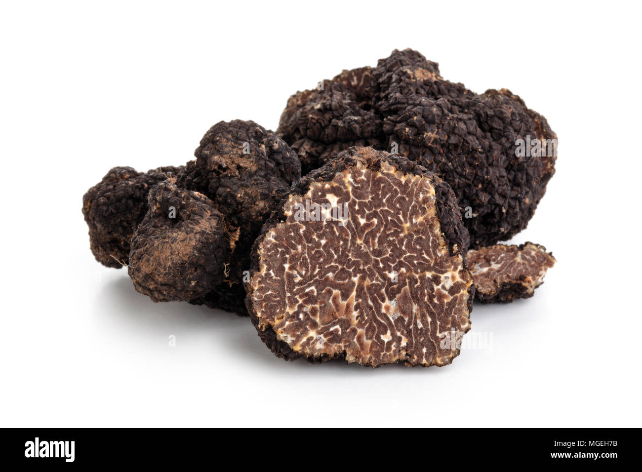 Black truffles and oak leaves.  Stock Photo