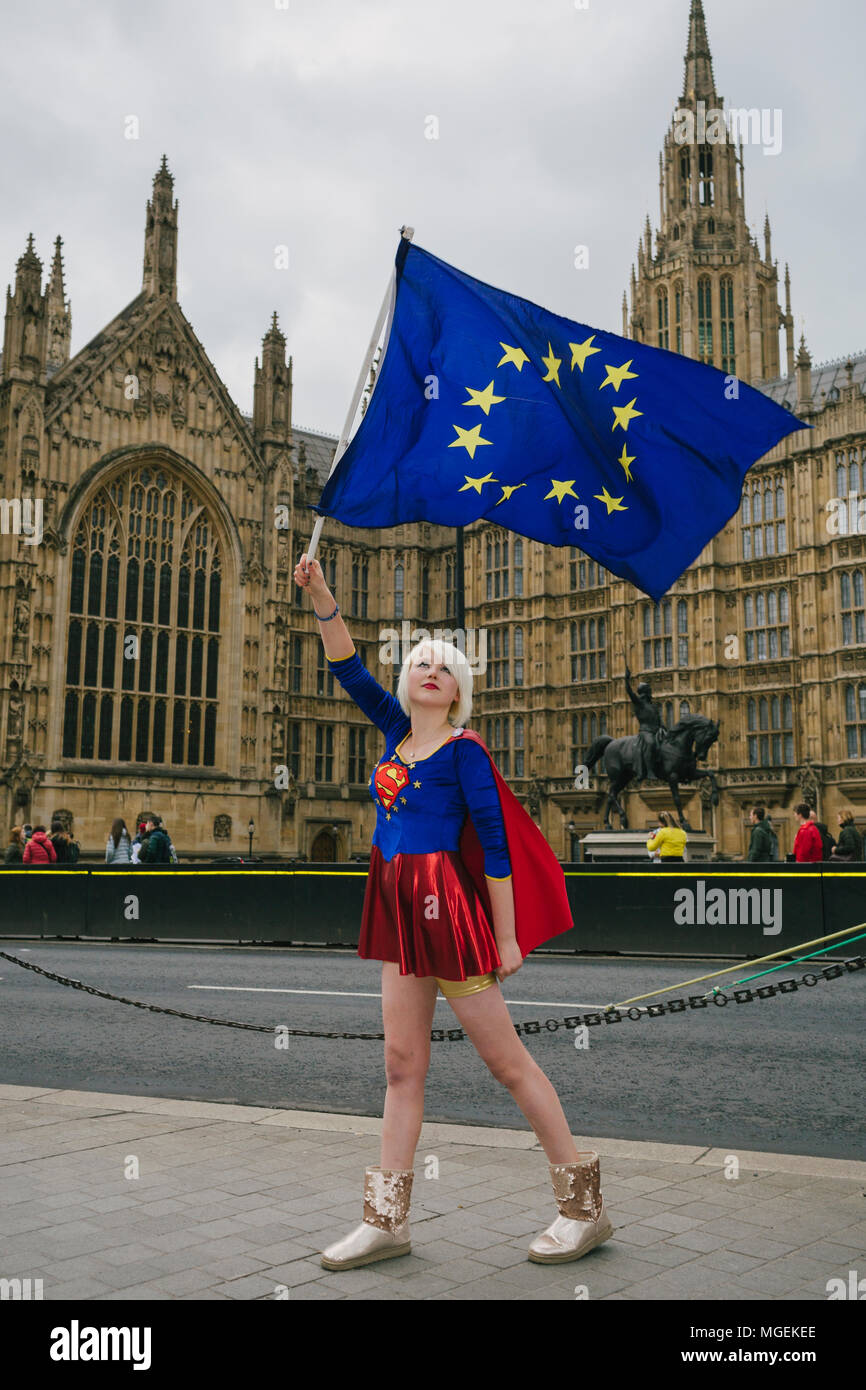 London, UK. 27th April, 2018. Madeleina Kay, also known as EUsupergirl, waving an EU flag outside Westminster, in support of campaign against Brexit Stock Photo