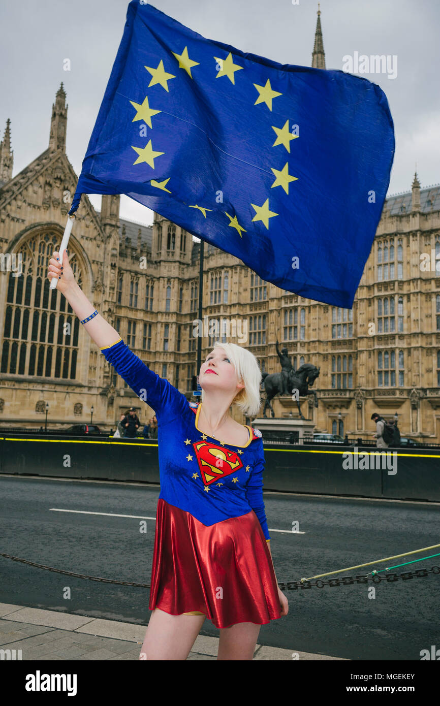 London, UK. 27th April, 2018. Madeleina Kay, also known as EUsupergirl, waving an EU flag outside Westminster, in support of campaign against Brexit Stock Photo
