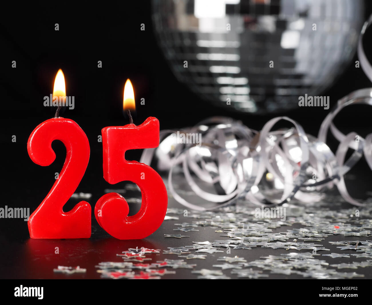Red candles showing Nr. 25  Abstract Background for birthday or anniversary party. Stock Photo