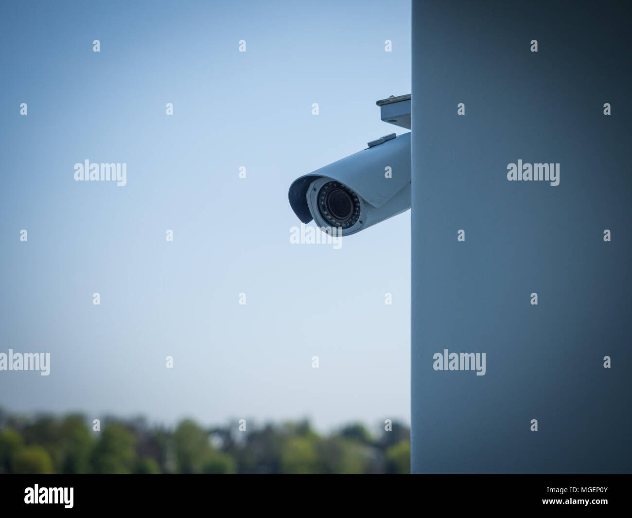 Security camera behind wall concept of privacy invasion issue Stock
