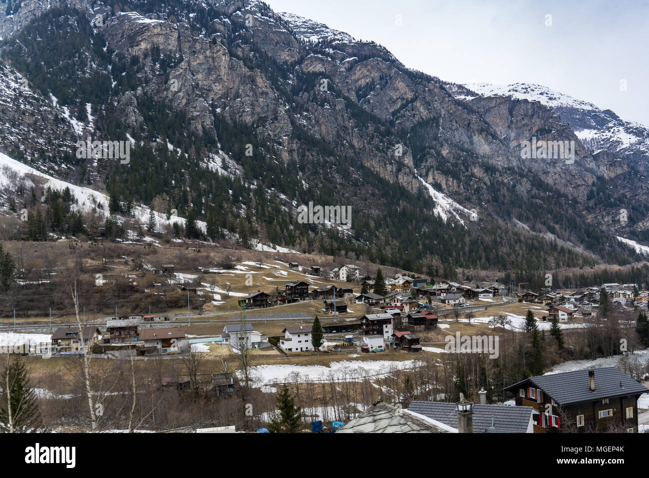 View of a village in the valley of the Alps in Switzerland Stock Photo ...