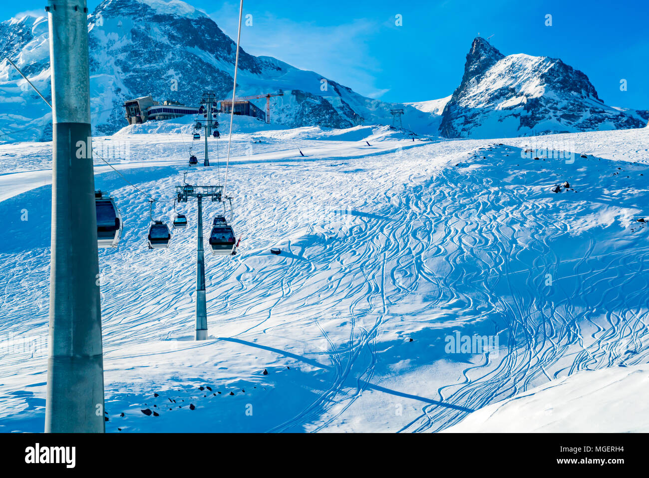 View of cable car to Klein Matterhorn Station with the ski track on the snow at Zermatt Village in Switzerland Stock Photo