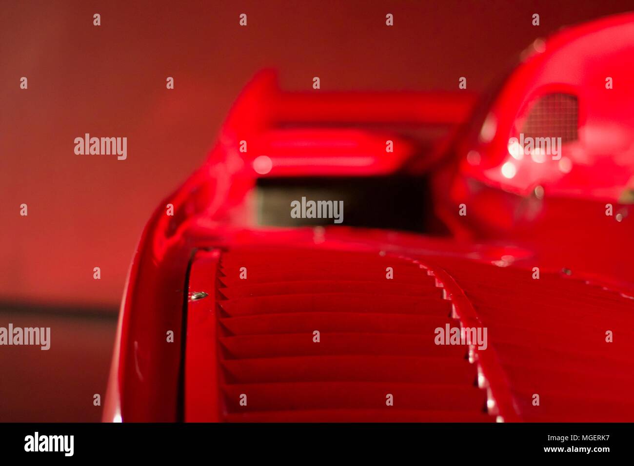 Focusing on the interior of a Ferrari red supercar on a red background Stock Photo