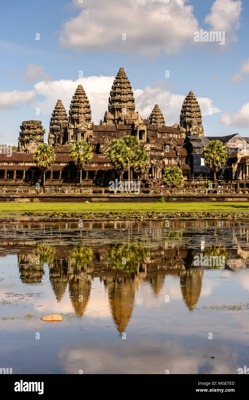 Angkor Wat (Temple City) and its reflection in the lake, a Buddhist, temple complex in Cambodia and the largest religious monument in the world. View  Stock Photo