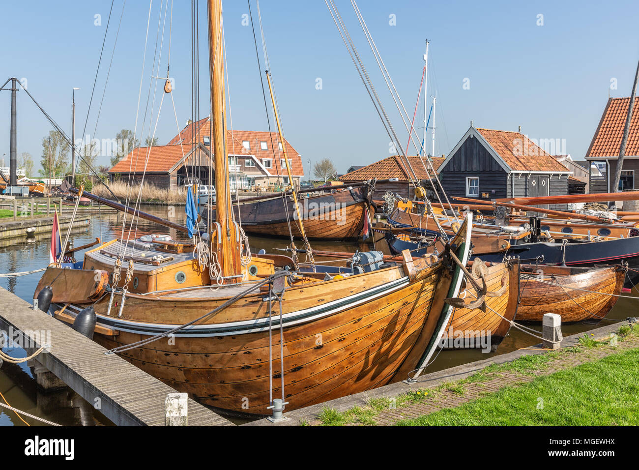 Historical fishing vessels anchored in harbor Dutch fishing village