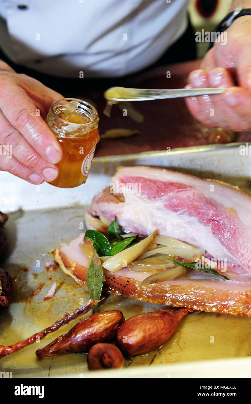 Food preparation - Caramelised pork chop with Cherrueix shallots from La Table du Marais restaurant, La Fresnais, France Stock Photo