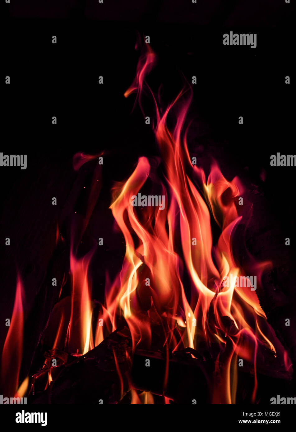 Red, orange and blue fire flames on black background Stock Photo - Alamy