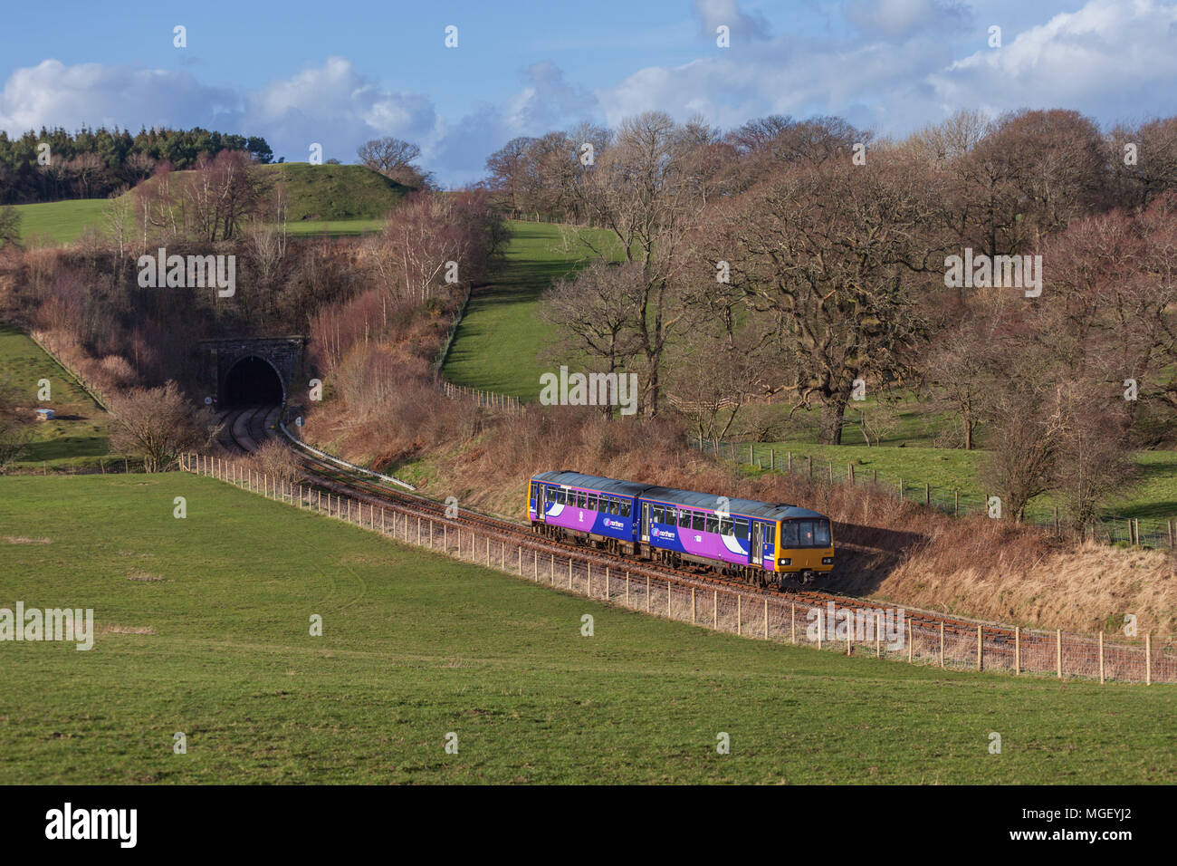 A Northern Rail pacer train  leaving Melling Tunnel, west of Wennington, on the Carnforth to Settle junction line Stock Photo