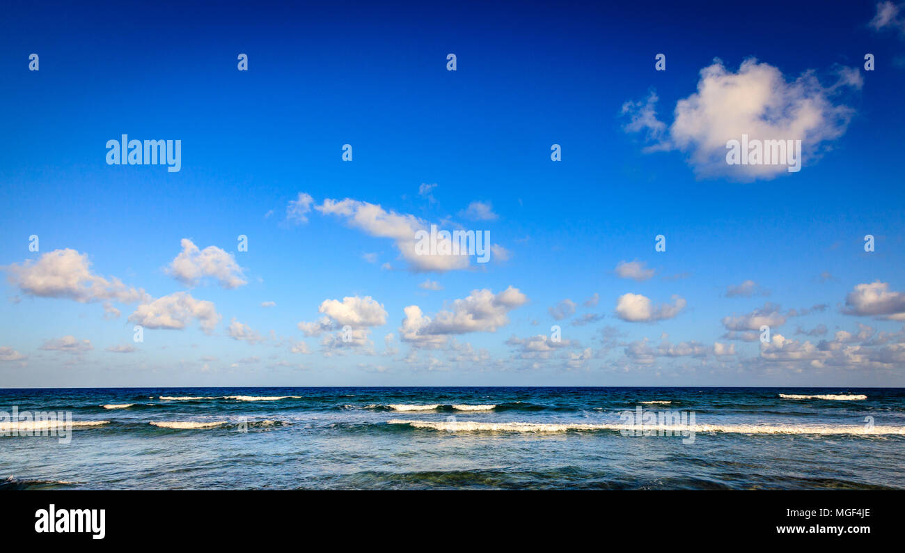 Scenic view of Caribbean Sea and blue sky with white clouds in BVI Stock Photo