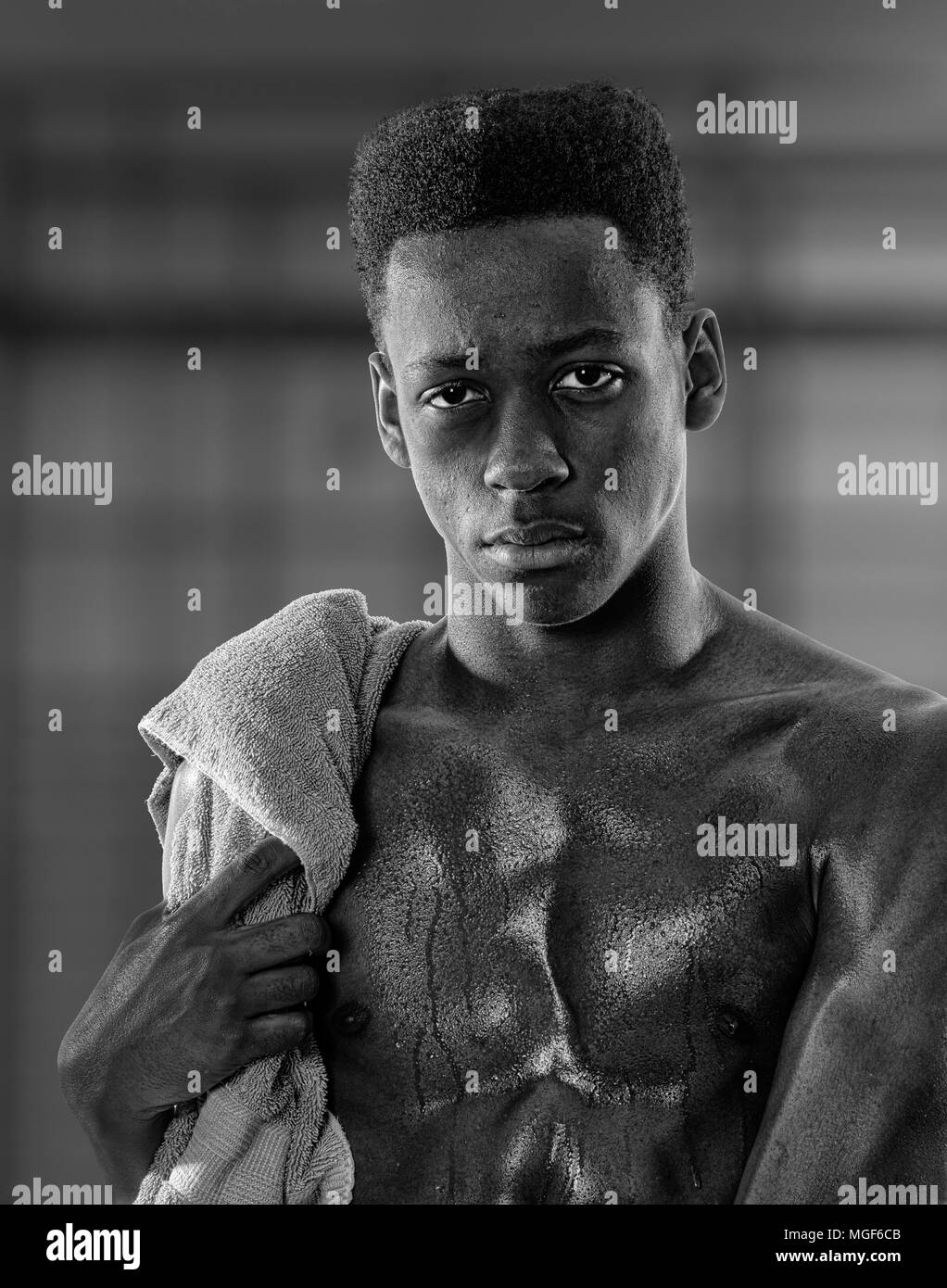 Young black man sweaty after exercise - with woel over shoulder Stock Photo