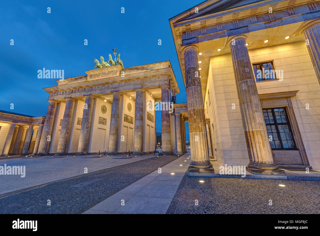 The famous illuminated Brandenburg Gate in Berlin, Germany, at night Stock Photo