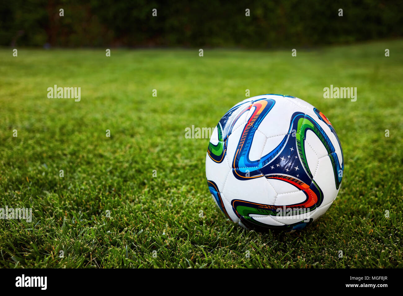 soccer ball on the grass field Stock Photo