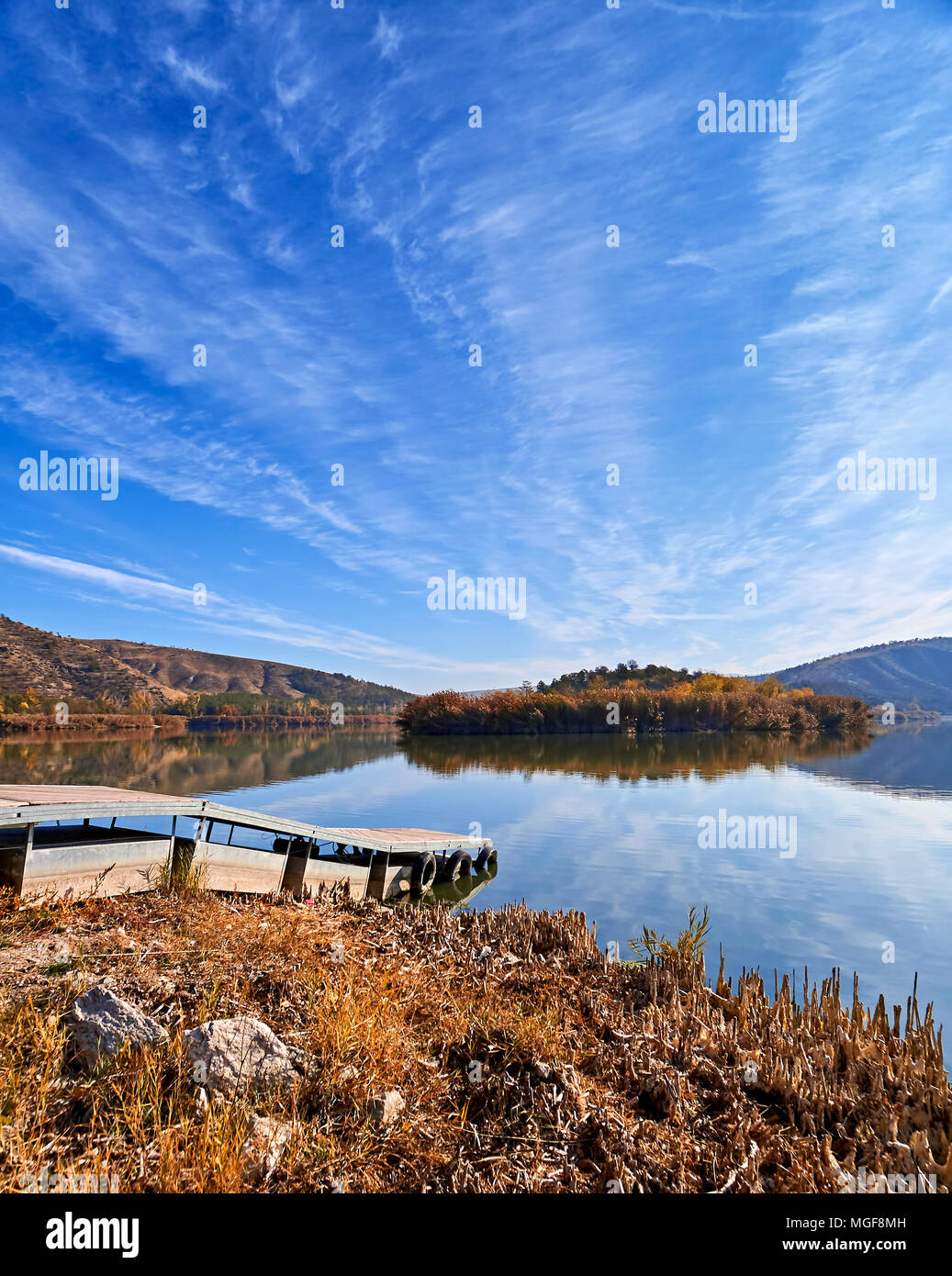Tranquil view of Eymir lake in Ankara Turkey including an islet covered  with trees and a pier in spring sunrise Stock Photo - Alamy