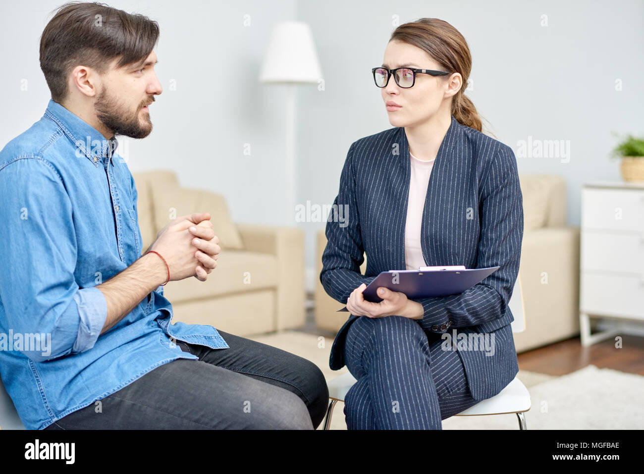 Handsome Bearded Man Suffering From Depression Having Consultation