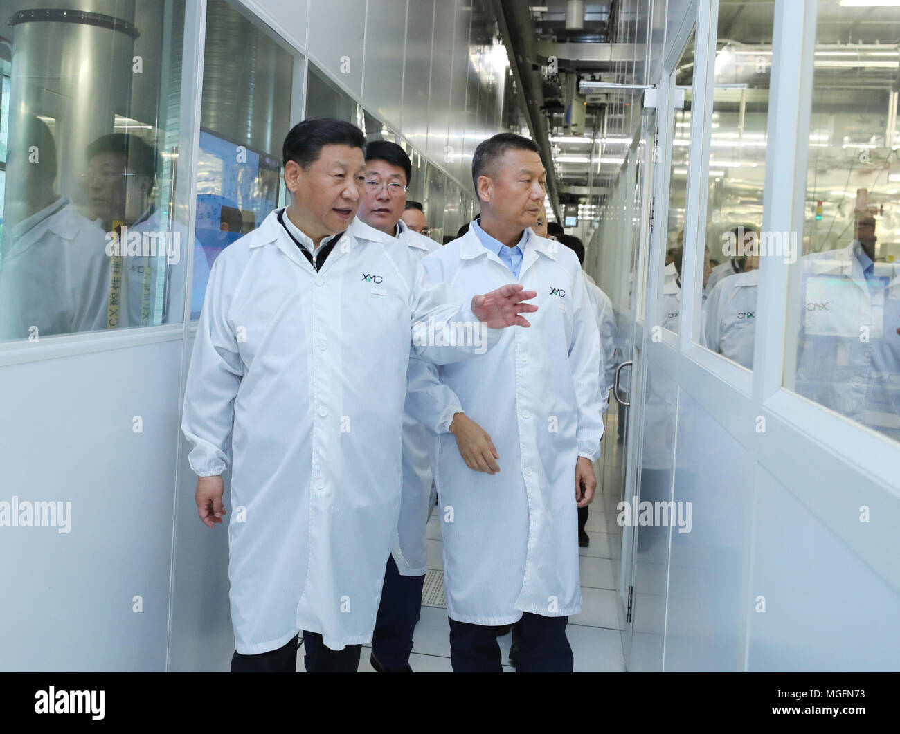 (180428) -- WUHAN, April 28, 2018 (Xinhua) -- Chinese President Xi Jinping, also general secretary of the Communist Party of China (CPC) Central Committee and chairman of the Central Military Commission, visits Wuhan Xinxin Semiconductor Manufacturing Corp. in Wuhan, capital of central China's Hubei Province, April 26, 2018. Xi made an inspection tour in Hubei Province from Tuesday to Saturday. (Xinhua/Ju Peng) (zyd) Stock Photo