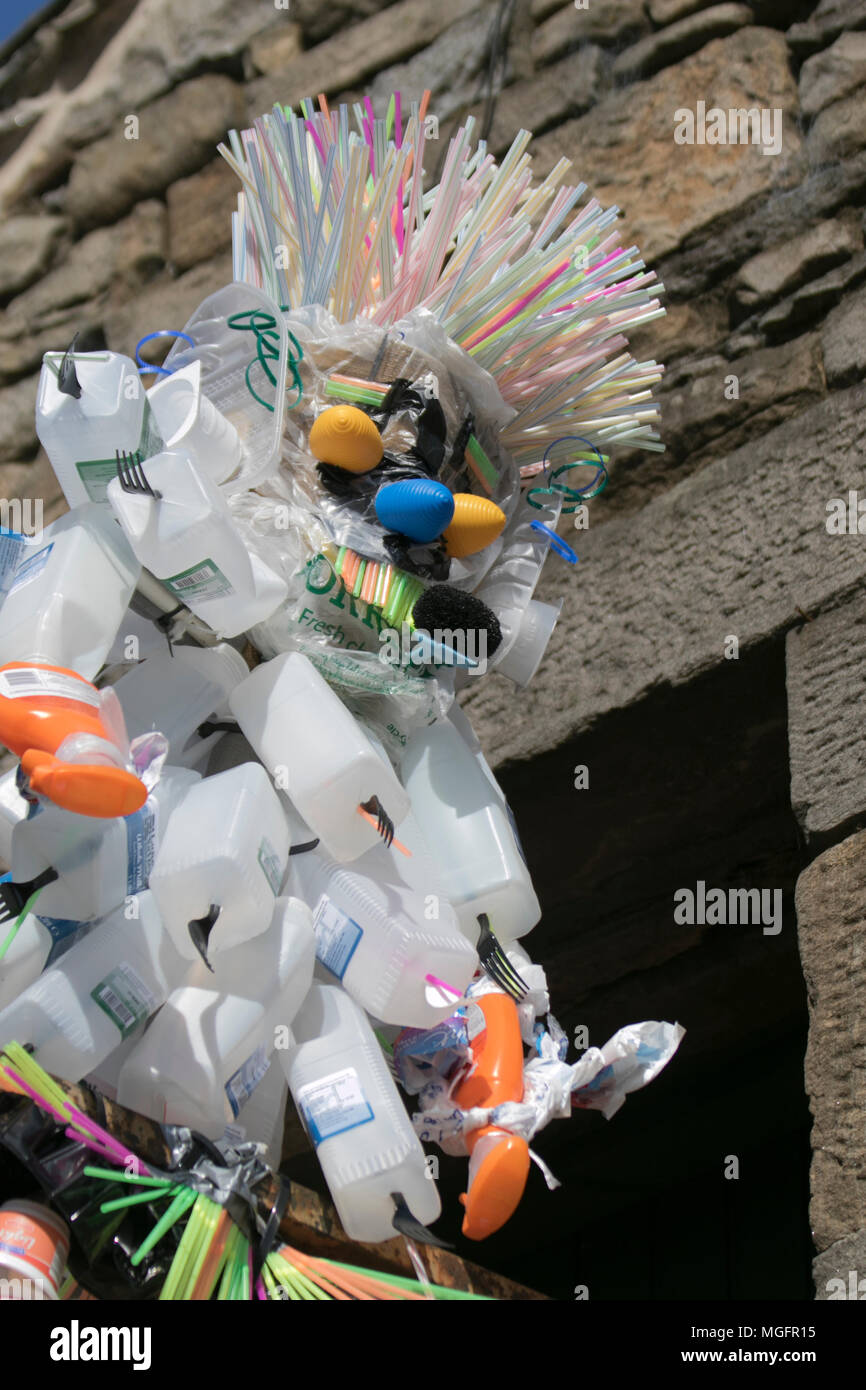 Upcycled, reused plastic sculpture figure in Wray, Lancaster, UK. Items  made from recycled plastic; Sculpting with pieces of plastic straws at the  Wray Scarecrow Festival and Fair. The villagers of Wray are