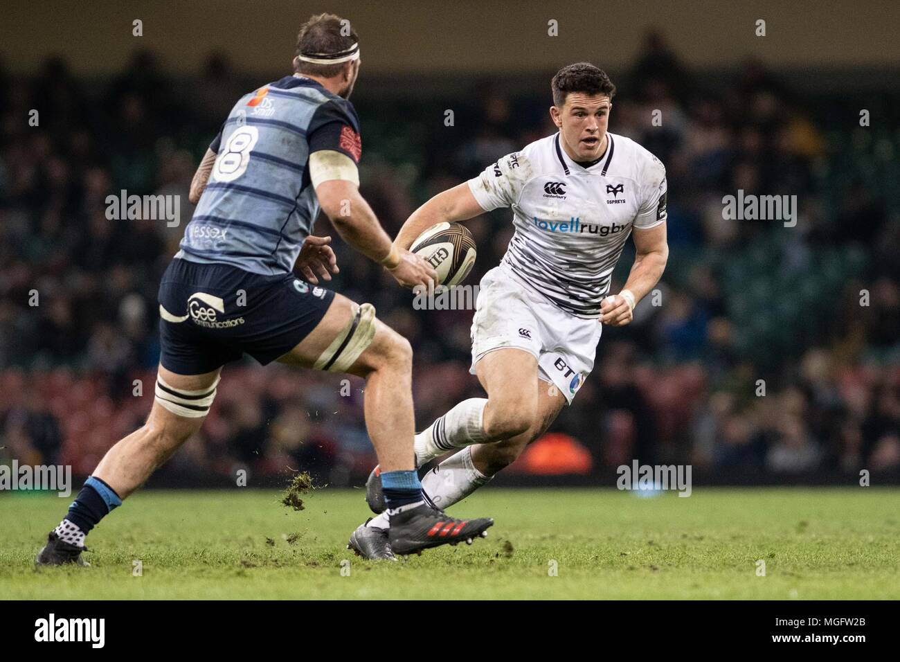 Cardiff, UK. 28 April 2018. Ospreys' Owen Watkin (r) takes Cardiff, UK. 28 April 2018. Cardiff Blues'  Josh Turnbull on the outside. Guinness Pro14 rugby match, Cardiff Blues v Ospreys , match two of Judgement Day at the Principality Stadium in Cardiff, South Wales on Saturday 28th April 2018. pic by Simon Latham, Andrew Orchard sports photography/Alamy live news Stock Photo