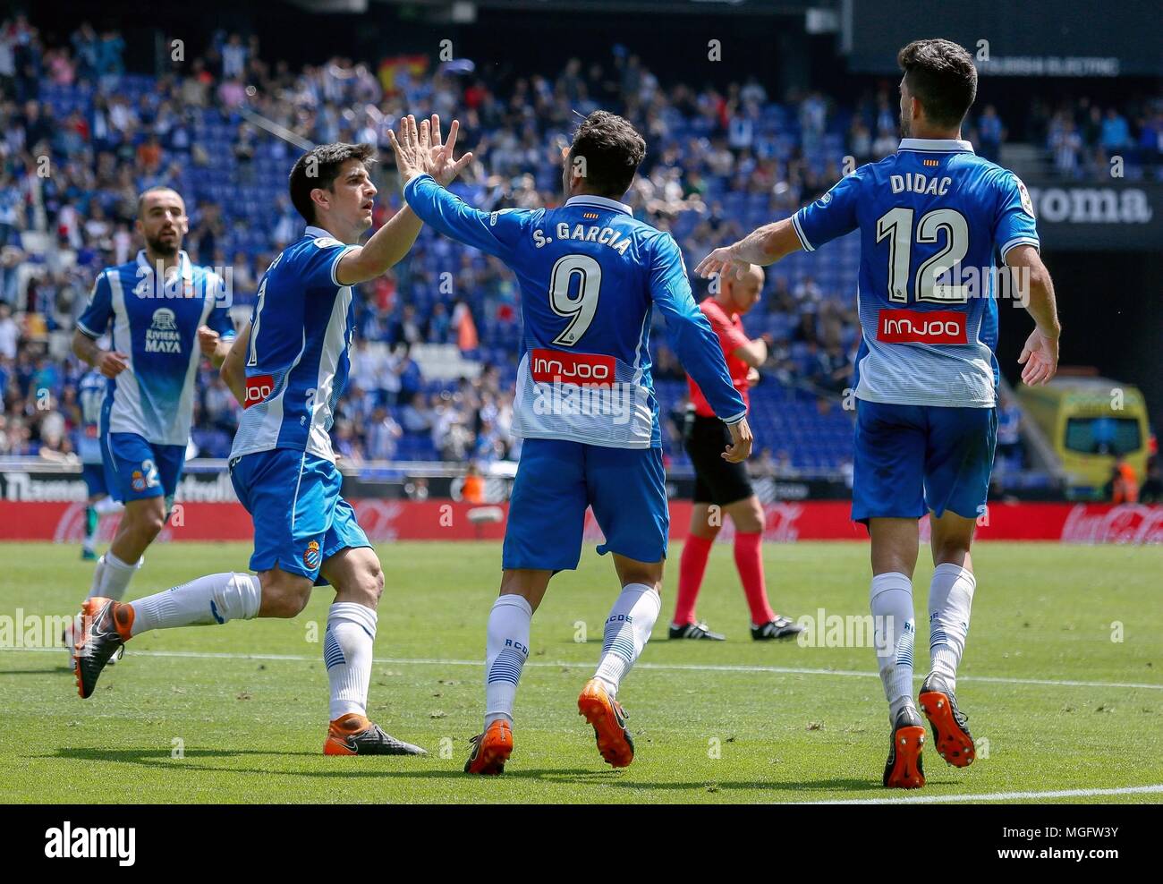 Barcelona, Spain. 28th Apr, 2018. RCD Espanyol's Gerard Moreno (2nd L) celebrates with Sergio Garcia (2nd R) during a Spanish league match between RCD Espanyol and Las Palmas in Barcelona, Spain, on April 28, 2018. The match ended 1-1. Credit: Joan Gosa/Xinhua/Alamy Live News Stock Photo