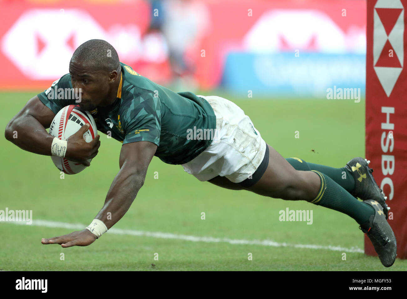 Singapore. 29th Apr, 2018. Siviwe Soyizwapi of South Africa scores a try during the Cup Quarter Final match between South Africa and Kenya at the Rugby Sevens tournament at the National Stadium. Singapore. Credit: Paul Miller/ZUMA Wire/Alamy Live News Stock Photo