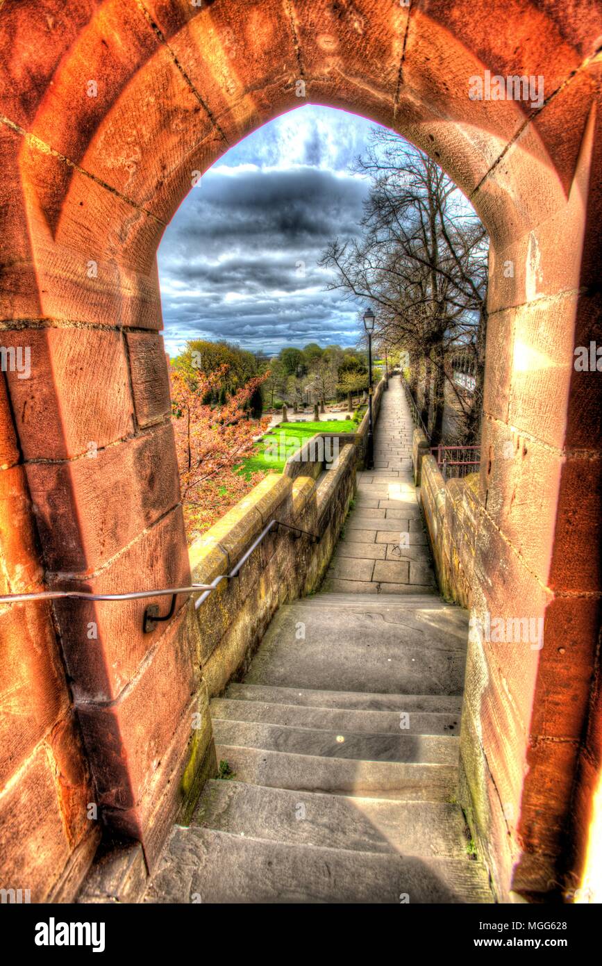 City of Chester, England. Artistic view of Chester City Walls at Newgate, with the wall walk and Roman Gardens in the background. Stock Photo