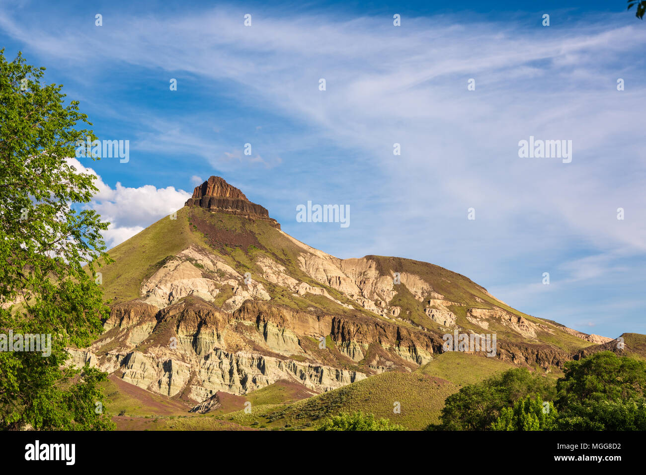 Sheep Rock as seen from Cant Ranch in Oregon. Claystone volcanic ash layers exposed by natural erosion, Stock Photo
