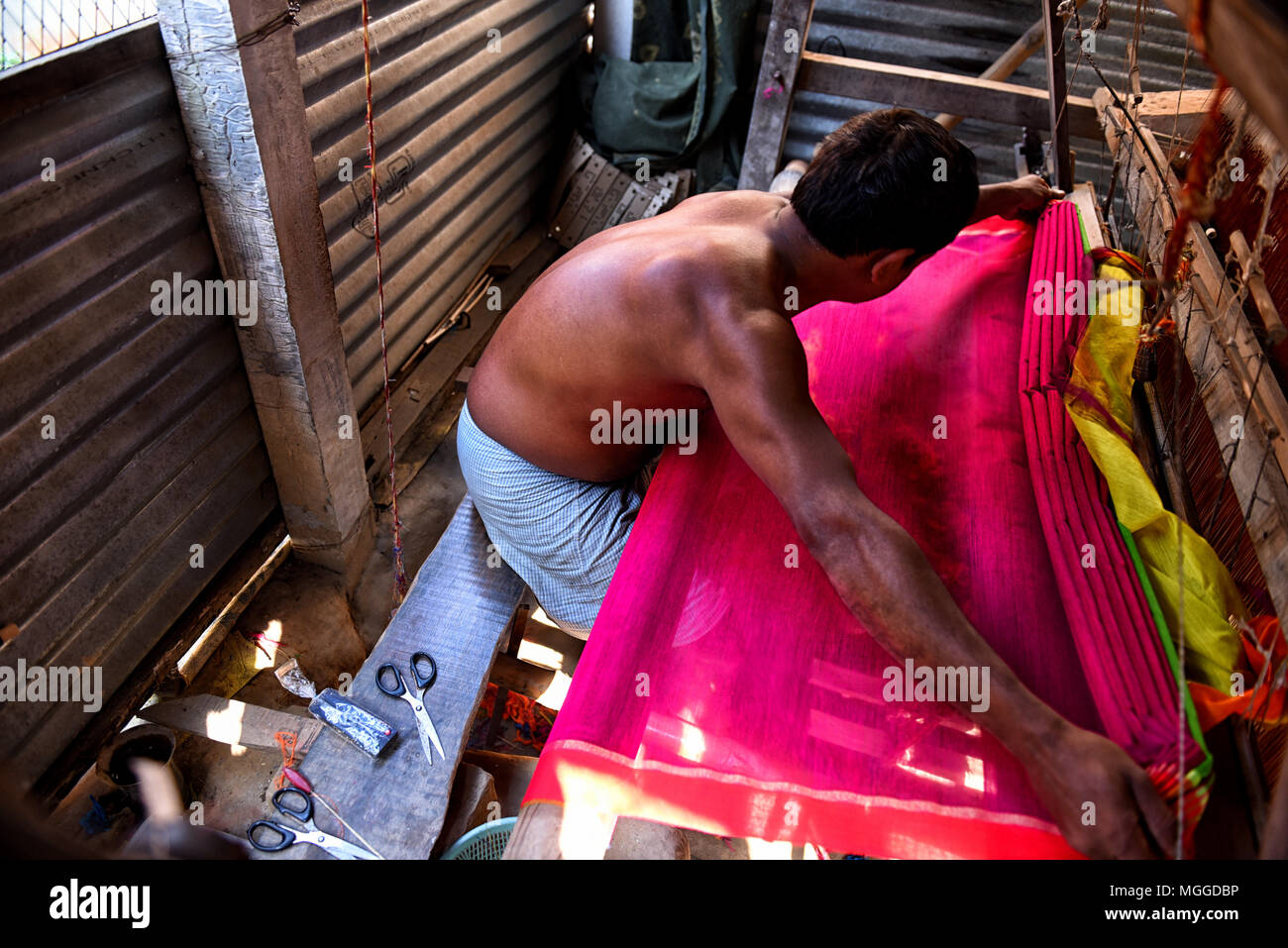Santipur, India. 03rd Feb, 2018. Daily wage labors are working in the small villages of West Bengal, India where they are involved in making Traditional Indian dresses for Woman - Saree . This is a total manual process which involves drying of jute fiber, extract of fine silk from the bobbins & finally preparation of Indian Traditional Saree. Credit: Avishek Das/Pacific Press/Alamy Live News Stock Photo